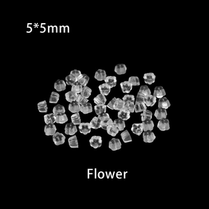 Macro view of 5x5mm transparent flower shaped silicone earring backs in bulk