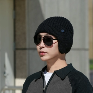 Men's winter knit beanie hat with ear flaps, thick fleece lining in black ribbed knit