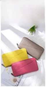 Three leather RFID wallets in khaki, yellow, and rose red with geometric texture