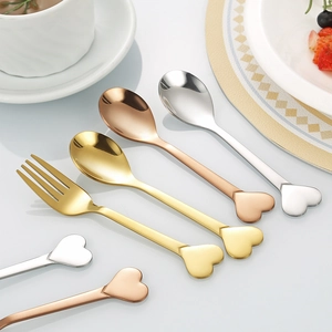 Stainless steel heart-shaped coffee spoons and dessert forks in gold, rose gold, and silver