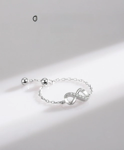 Detailed view of adjustable silver infinity ring with micro-pave zirconia stones