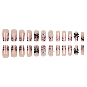 Pink leopard zebra press-on nails with 3D black bows and pearl heart charms