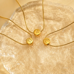 Golden stainless steel snake chain necklace set with sliding round alphabet A B C pendants
