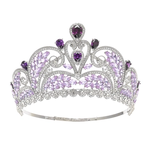 Baroque bridal crown with purple zircons and silver leaves on a white background