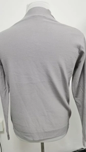 Back view of a grey V-neck knit cardigan showing detailed honeycomb texture and ribbed hem