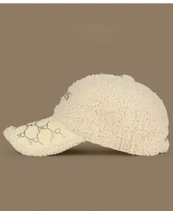 Detail of warm beige fleece baseball cap with rhinestone PARIS text and pattern embroidery