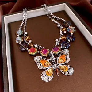 Vintage butterfly pendant necklace with faceted gemstones and multi-color glass beads