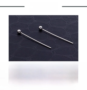 Macro detail of stainless steel ball pins for DIY jewelry making in natural steel color