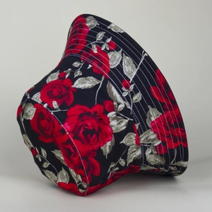 Close-up of red rose floral print on black cotton bucket hat showing stitching detail