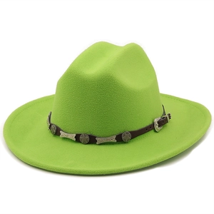 Detail of neon green wool cowboy hat with brown leather band and silver star studs