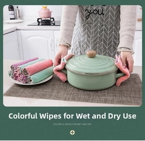 Thick microfiber cleaning cloth used as a heat-resistant pad for moving a hot kitchen pot