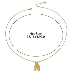 Detailed view of gold necklace with ballet slipper pendant and 46+5cm length specs