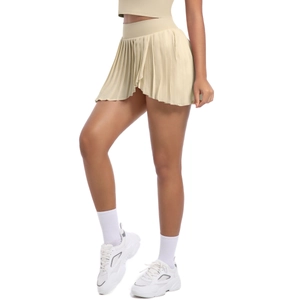 Detail of cream pleated sports skirt with side pocket and inner shorts for tennis