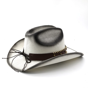 Detail of woven straw cowboy hat with silver base, black gradient spray, and leather band