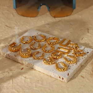 Collection of gold-plated stainless steel chunky croissant and twist hoop earrings