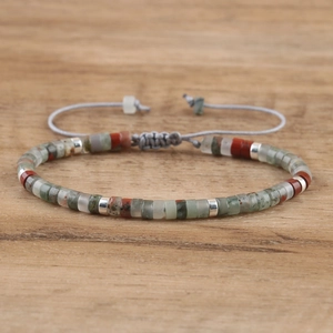 Detailed view of handmade imperial stone beaded bracelet with adjustable woven sliding knot