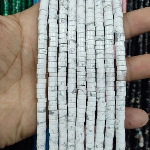 Macro shot of white howlite stone spacers with grey marble veins for jewelry making