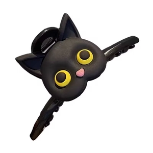 Black cat hair claw clip with yellow eyes for elegant back of head styling