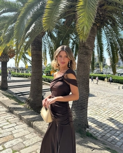 Detail of side ruching and cutout design on dark brown one-shoulder summer dress