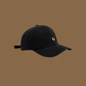 Minimalist black cotton baseball cap featuring detailed Corgi dog embroidery on front