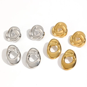 Polished 18k gold and silver geometric spiral stud earrings in a four-pair product matrix