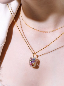 18K gold-plated necklace featuring a square pendant set with colorful vibrant gemstones