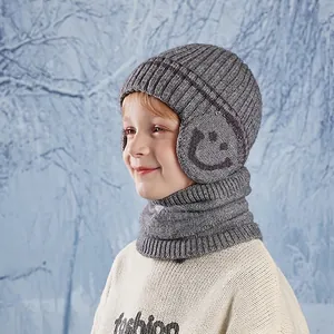 Kids grey knitted winter hat and scarf set with earflaps and warm fleece lining