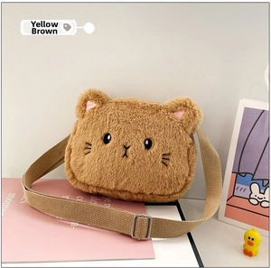 Close-up of yellow-brown plush cat bag with embroidery and adjustable strap