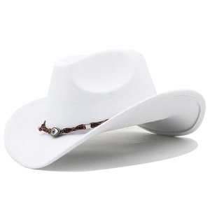 Detailed shot of white felt cowboy hat with braided leather band and evil eye bead
