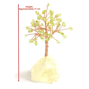 Detail view of handmade green crystal tree of life on natural base, 11cm height