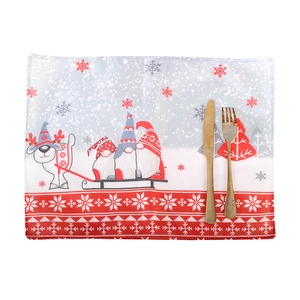 Christmas placemat with Nordic gnome and reindeer pattern including golden cutlery