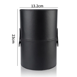Detail of a black leather makeup brush holder showing 23cm height and 13.2cm width
