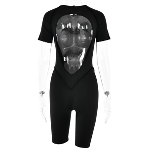 Detail of black slim fit short sleeve romper with transparent back patchwork design