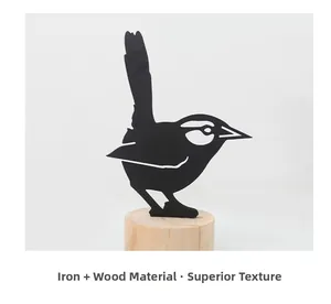 Detail of iron bird silhouette figurine with a rustic natural wooden base stand