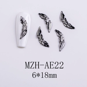 Detailed silver metal feather nail art charm with intricate texture, 6x18mm size