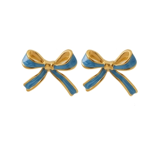 Detailed macro view of golden bow earrings with premium blue enamel oil filling finish