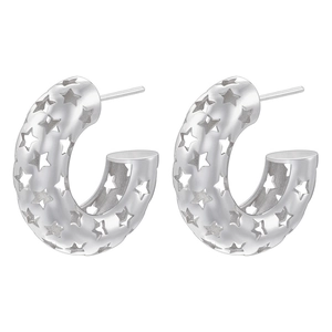 Detailed view of silver C-shaped earrings with hollow star patterns and smooth edges
