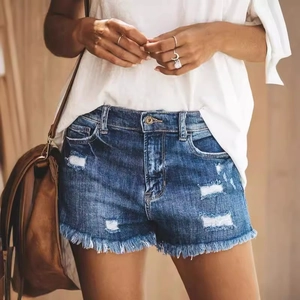 Women's high waist denim shorts with ripped details and frayed hem in blue
