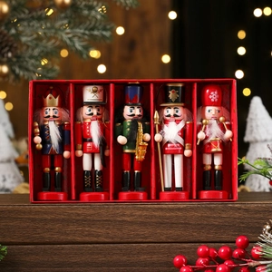Five-piece Christmas nutcracker soldier gift set in red box with warm bokeh background