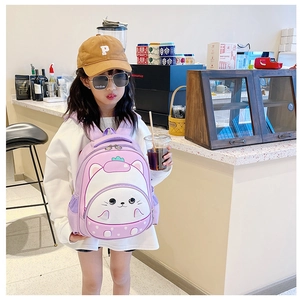Girl wearing a purple 3D cartoon strawberry backpack in a cafe, showing fit and size