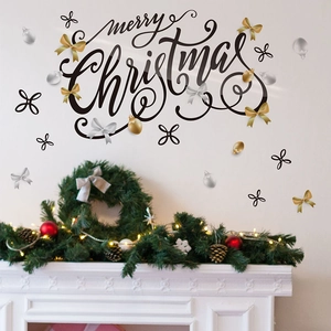 Christmas wall decal with Merry Christmas letters and ornaments above fireplace
