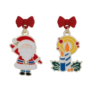 Detail of Christmas earrings featuring Santa Claus, holly candle, and red bows