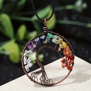 Detailed close-up of handmade bronze wire-wrapped tree of life pendant with colorful stones