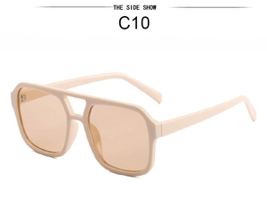 Macro detail of retro square double-bridge sunglasses with cream frames and orange lenses
