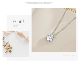 Detail of silver solitaire necklace featuring a round brilliant-cut stone in six-prong setting