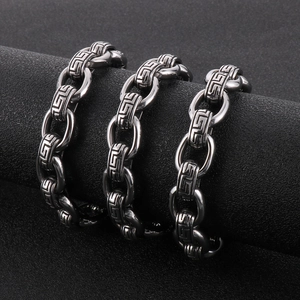 Close-up of 12mm titanium steel O-chain with engraved Greek Key patterns