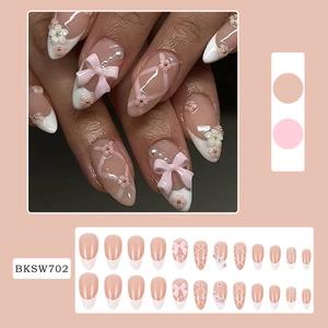 Long nude press-on nails set with 3D bows, flowers and pearls detail, model BKSW702