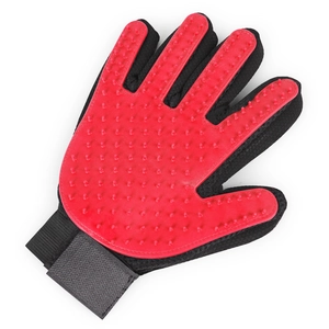 Close-up of red silicone pet grooming glove with soft bristles and black mesh fabric