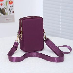 Versatile purple nylon crossbody phone bag with double zipper and adjustable strap
