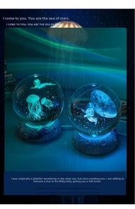 Detail of 3D laser engraved crystal ball night light with textured moon surface base